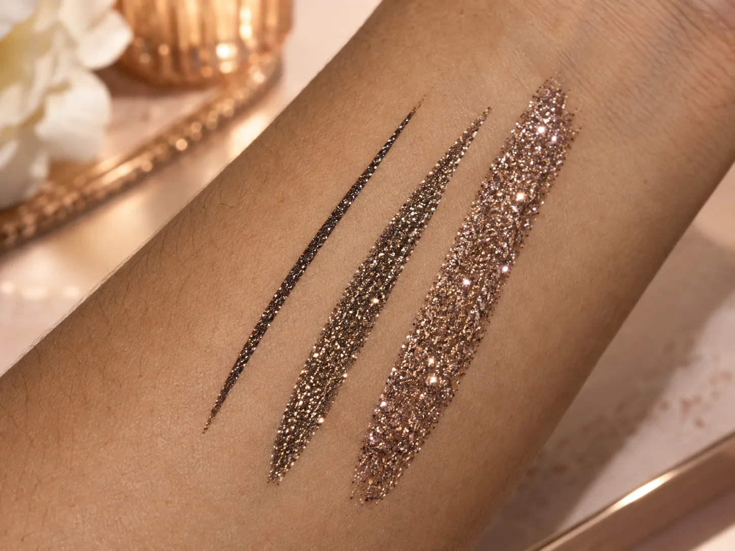 Close-up of glitter eyeliner sparkle and reflective particle finish