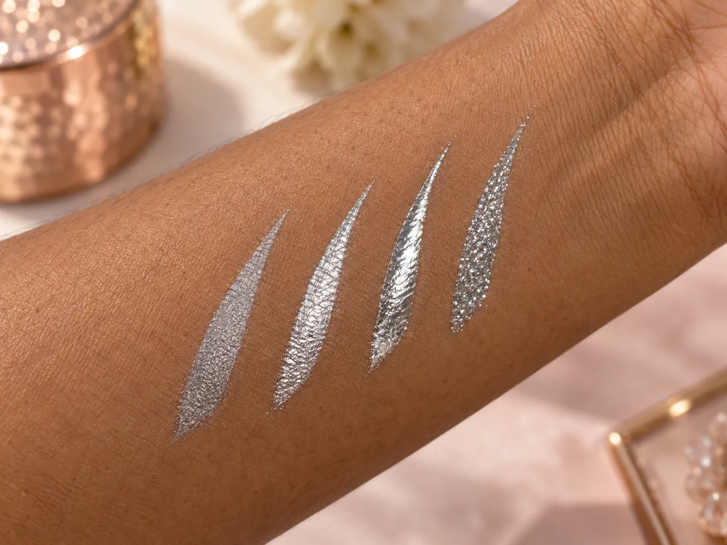 Chrome, metallic and pewter silver eyeliner swatches on brown skin